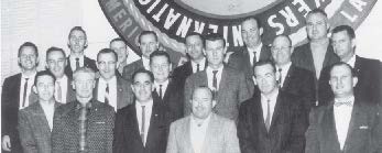 Local 1245 staff, in 1960 or 1961. Front row, from left: Howard Sevey, ofﬁce  manager; Mark  Cook, business rep; Larry  Foss, business rep; Jack Wilson, business rep; John Wilder, business rep; and Mert Walters assistant business manager. Back row: Norm Amundson, business rep and Utility Reporter editor; Roy Murray, business rep; Jim McMullin, business rep; Gene Hastings, business rep; L.L. Mitchell, assistant business manager; Ron Weakley, busines manager; Ed James, business rep; Al Kaznowski, business rep; Scott Wadsworth, business rep; Dan McPeak, business rep; Al Hansen, assistant business manager; Frank Quadros, business rep; and Spike Ensley, business rep.