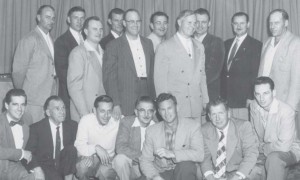 The amalgamated staff of IBEW Local 1324 and 1245 consisted of, standing from left: Jerry Moran, Charley Massie, Mert Walters, Scott Wadsworth, Al Hanson, Gene Hastings, Ed White, Harry Bollard, Weakley, and Cy Yochem. Kneeling from left: Fred Lucas, Delbert Pet- ty, Al Kaznowski, Elmer Bushby, Lee Andrews, Jim Cribbs, Howard Sevey, and L.L. Mitchell (who  is not shown because he was taking the  picture.)