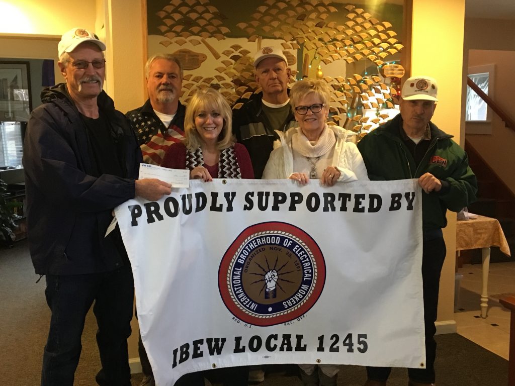 Presenting the donation to Reno Veterans Guest House, from left: Reno/Sparks IBEW 1245 Retirees Club President Ron Borst, Rod Thomas, Veterans Donation Administrator Linda Grace, Cyril Escallier, Vickie Borst, Frank Istrice