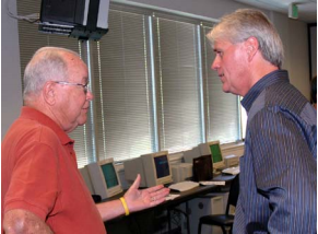 Jack Hill, left, discusses retirees’ plight with thenPG&E President Bill Morrow. 