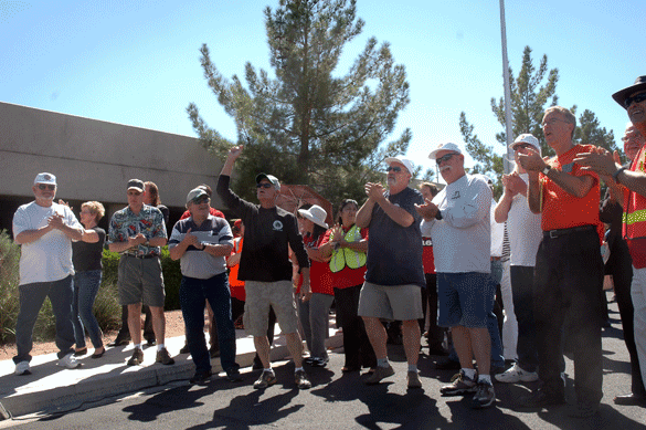 IBEW Local 1245 retirees and supporters get fired up to "Who Let the Dogs Out" before the picket.
