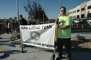David Thieme displays the Solidarity Action Network banner at the picket and rally. To sign up for the Solidarity Action Network, go to www.ibew1245.com/solidarity_action.html 