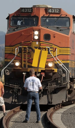 A union worker blocks a grain train in Longview, Wash., Wednesday, Sept. 7, 2011. Longshoremen blocked the train as part of an escalating dispute about labor at the EGT grain terminal at the Port of Longview. (AP Photo/Don Ryan 