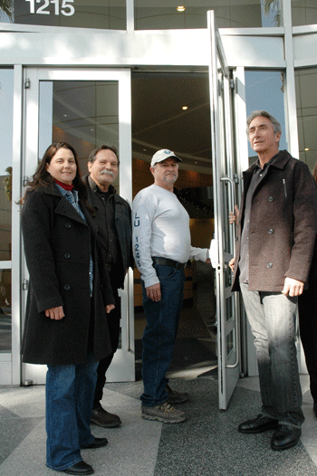 Lisa Jones, Jay Hepper, John Mummert and Mike Farmer prepare to deliver a letter to Calpine management at the company's Sacramento headquarters. The managers chose to close the office all day rather than meet with the employees.
