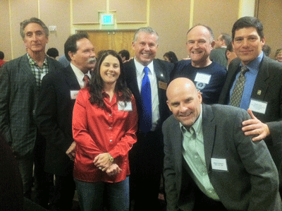 Assemblyman Mike Allen stands in support of Calpine workers at the North Bay Labor Council holiday dinner. From left: Mike Farmer, Jay Hepper, Lisa Jones, Assemblyman Allen, Brian Gleason (front), John Mummert, and Local 1245 Business Rep. Hunter Stern