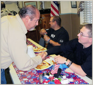 Veteran Doug Harris is greeted by a well-wisher at his homecoming party.