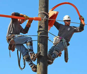 The SMUD team of Matt Wilson, Cayleb Bowman and Greg Baird was one of several Local 1245-sponsored teams competing at the Hawaii Lineman’s Rodeo.  Photo by Ron Cochran