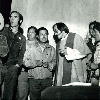 Fred Ross Jr., now an organizer for IBEW Local 1245, Cesar Chavez , Father Jim Conroy and UFW general counsel Jerry Cohen at a large nighttime rally on the Oregon capitol steps to pressure Republican Gov. Tom McCall to veto an anti-farmworker bill in the 1970s. (He did.)