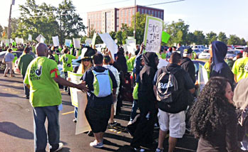 Protesters gather outside the Walmart Shareholders meeting on June 7.