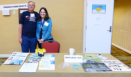 IBEW 1245 Retiree Club activist Ken Rawles, right, and IBEW 1245 Organizer Eileen Purcell staff the union’s table at CARA’s 10th annual convention. 