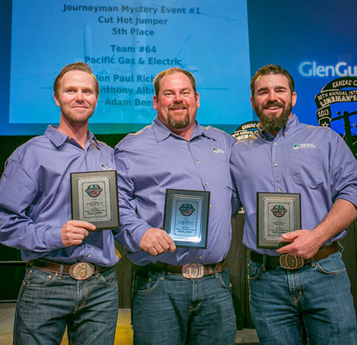 Accepting the 5th place award for Mystery Event #1 are, from left, Anthony Albright, Jon Paul Richard and Adam Beene—PG&E.