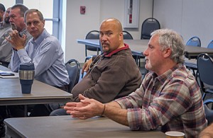 Steve Segale talks about the value of well-trained clerical workers. Looking on are John Blaylock, immediate left, and Steve Rayburn.