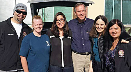 Preparing to leave for Medford on the morning of Feb. 12 are, from left, Organizing Stewards Michael Musgrove and Kristen Rasmussen. Joining them for a quick send-off in the Weakley Hall parking lot are IBEW Organizers Jennifer Gray, Fred Ross Jr., Eileen Purcell and Jammi Juarez. 
