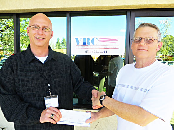 Paul Snyder, chairman of City of Redding Unit 3217, IBEW Local 1245, makes a donation to the Redding Veterans’ Resource Centers of America. Read more about IBEW 1245’s efforts on behalf of veterans in Redding and elsewhere at //www.ibew1245.com/news-Local1245/Vets_Give_Back_3-5-14.html