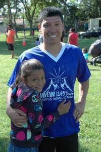 A member of the Fresno team with his daughter