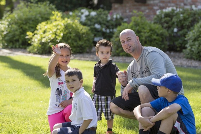 Dwight Johnson and all of his kids (left to right) Lauren, Ryan, Mason and Eric. Photo credit: SMUD