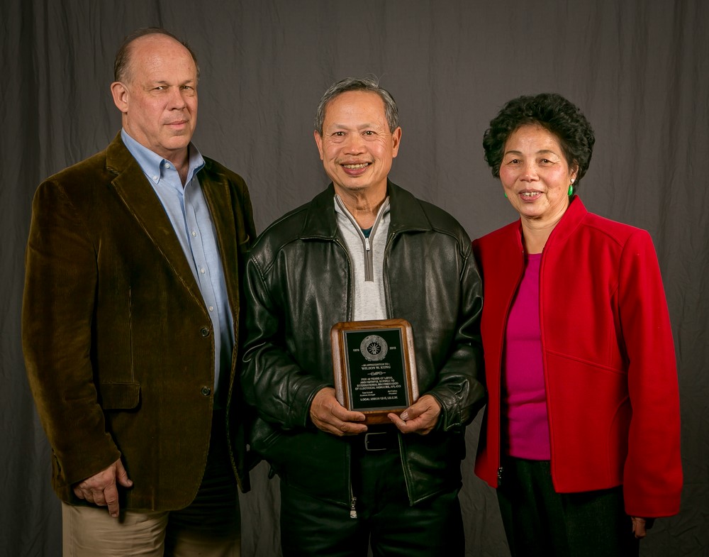 40 year member Wilson Kung and his wife with Tom Dalzell 