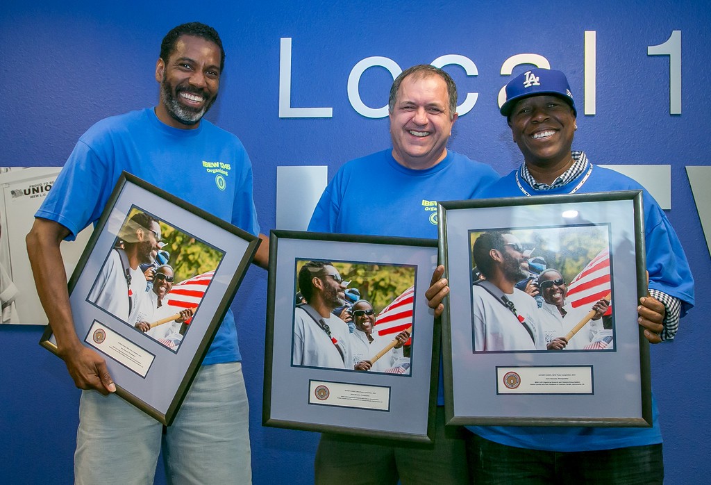 Steven Marcotte (center) was recognized for his award-winning photo, which features Walter Carmier (left) and Pam Pendleton (right)