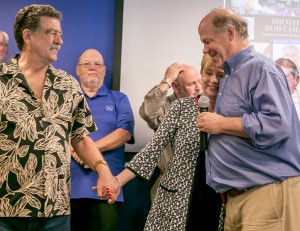 Business Manager Tom Dalzell (right) and President Art Frietas share an emotional moment with Brother Choate's wife
