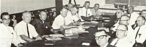 Negotiating for the union at USBR in 1964 are, on the left side of the table: Ray Spence, Business Representative Mark Cook, Max Paris, Assistant Business Manager Mert Walters, Bill Peitz, Ralph Henderson, George Thompson, and Gordon Sewell. IBEW 1245 Archive 