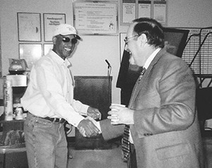 Business Manager Perry Zimmerman greets Lineman Marshall Williams in PG&E’s Kern Division in 2002. Zimmerman visited some 200 work places during his first year in office. IBEW 1245 Archive