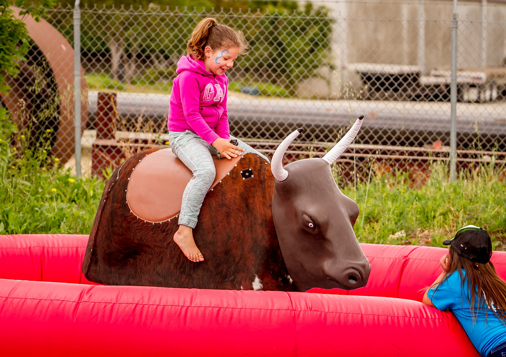 Children took turns riding the mechanical bull