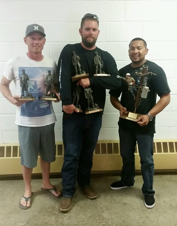 Luke Bogart, Jacob Hunt and Marco Acosta show off their trophies at the NSUJL rodeo 