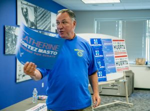 Chris Cunnie holds up a sign for Catherine Cortez-Masto, the union-endorsed candidate for Senate in Nevada