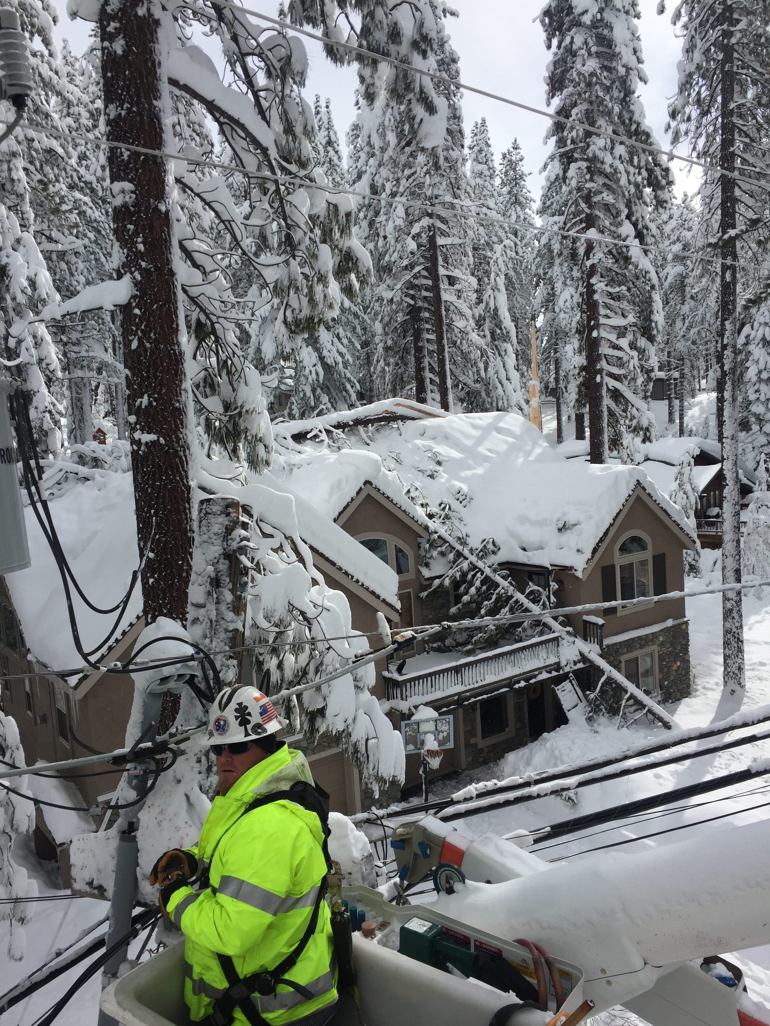 NV Energy Lineman Jeremy Parks making repairs on lines that were brought down by trees weighted down with snow