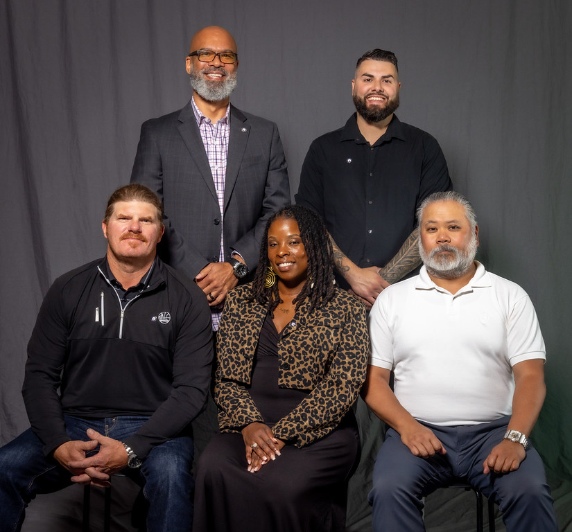 5 year members, front row; l-r; Corey Foster, Shimia Buie, Geraldo Guinto. Back row: Senior Assistant Business Manager Anthony Brown, Alfonso Cazares. 