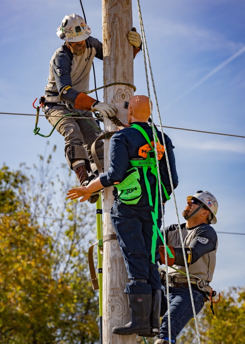 The PG&E team of Brandon Dance, Francisco Flores and Dustin Curry in the Pole Climb event. The International Lineman’s Rodeo in Bonner Springs, Kansas on October 19, 2024.