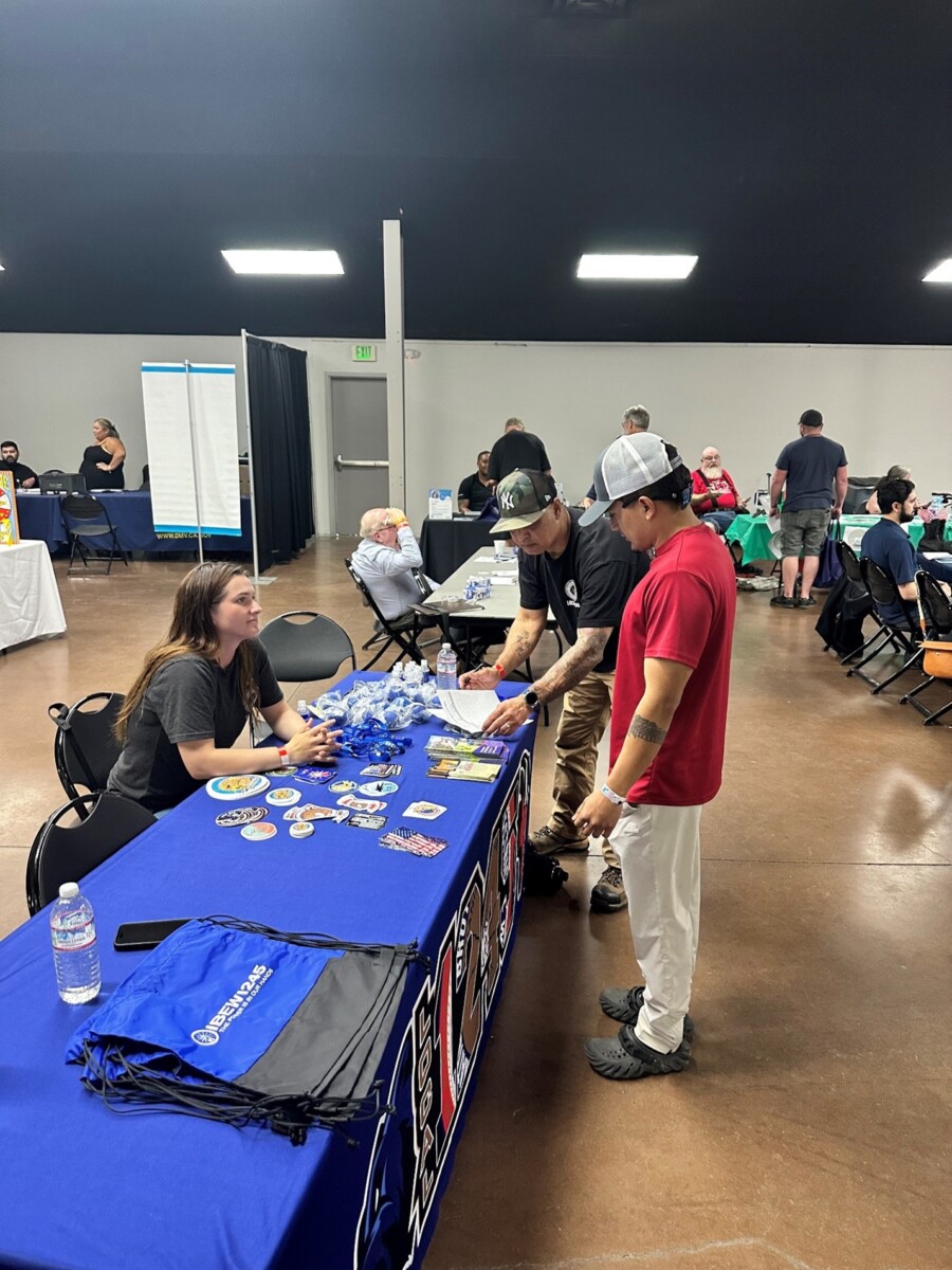 Kaycee King & Rafael Burgos speaking with attendee at Yuba/Sutter Veterans Stand Down