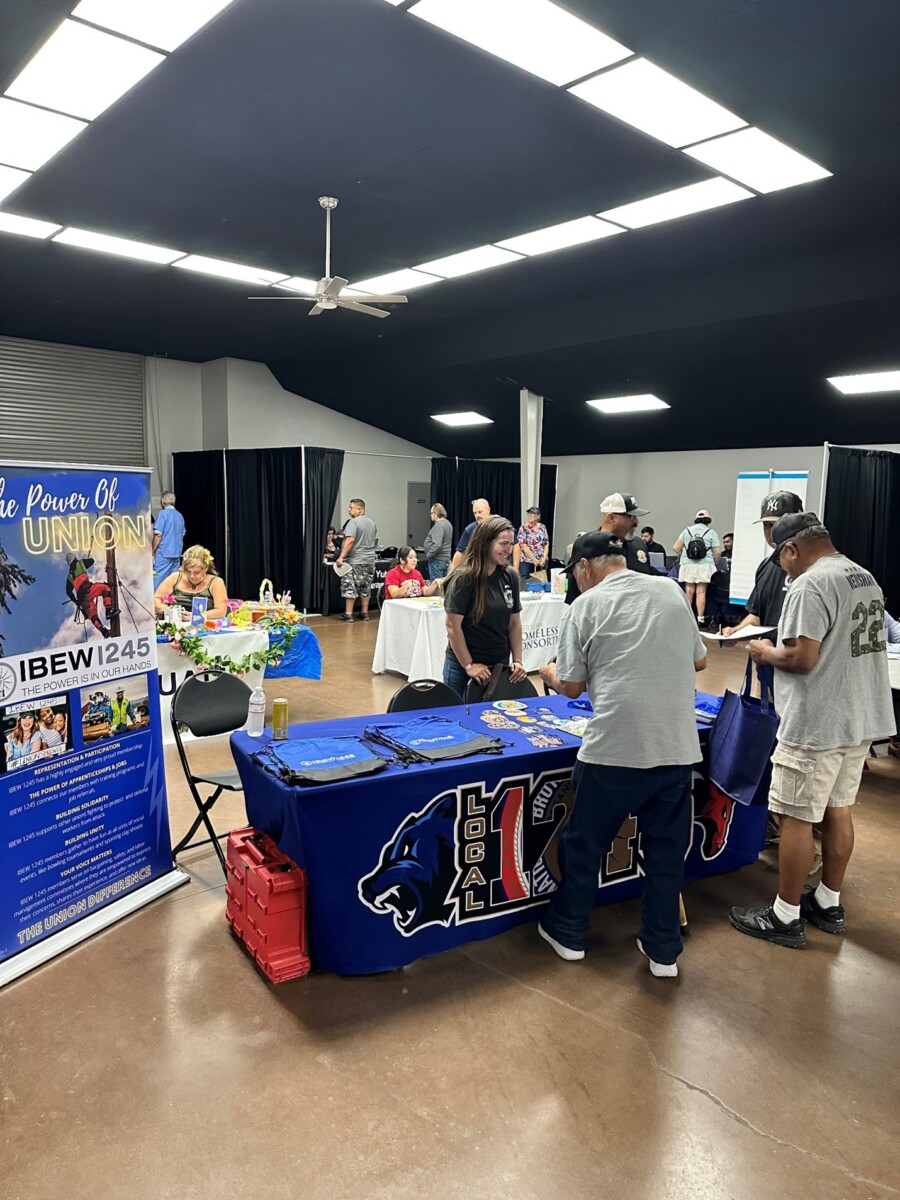 Kaycee King speaking with attendee at Yuba/Sutter Veterans Stand Down