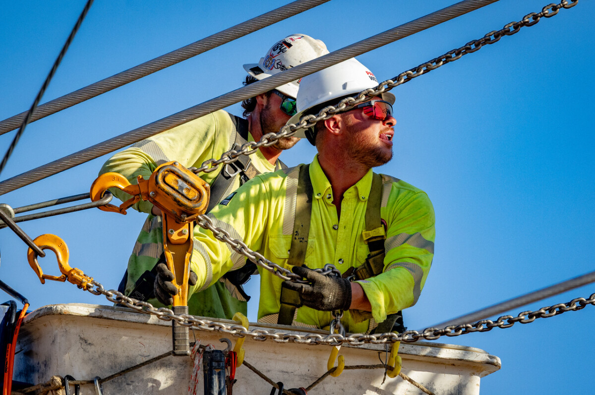 Linework is a team effort — apprentices and journeymen working side by side, each move synchronized to get the job done right.