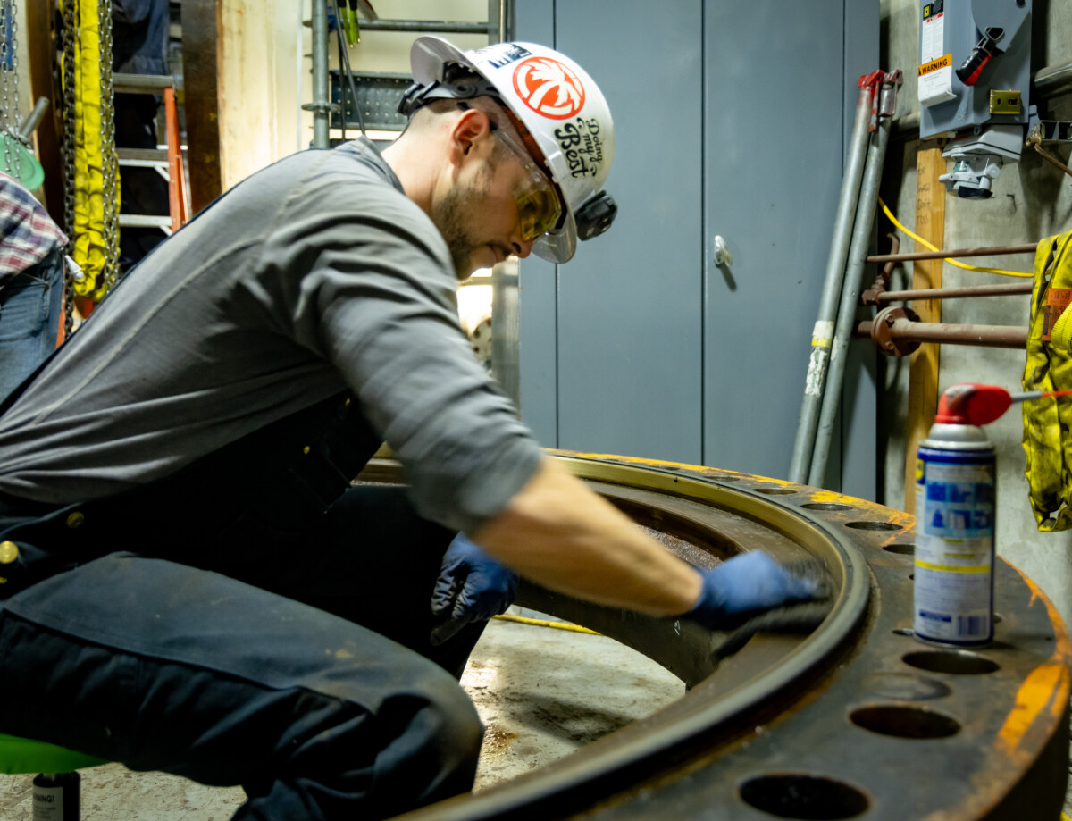 Michael Rouch, Mechanical Foreman at Yuba Water Agency, inspecting and restoring massive turbine components during a rare full dewatering.